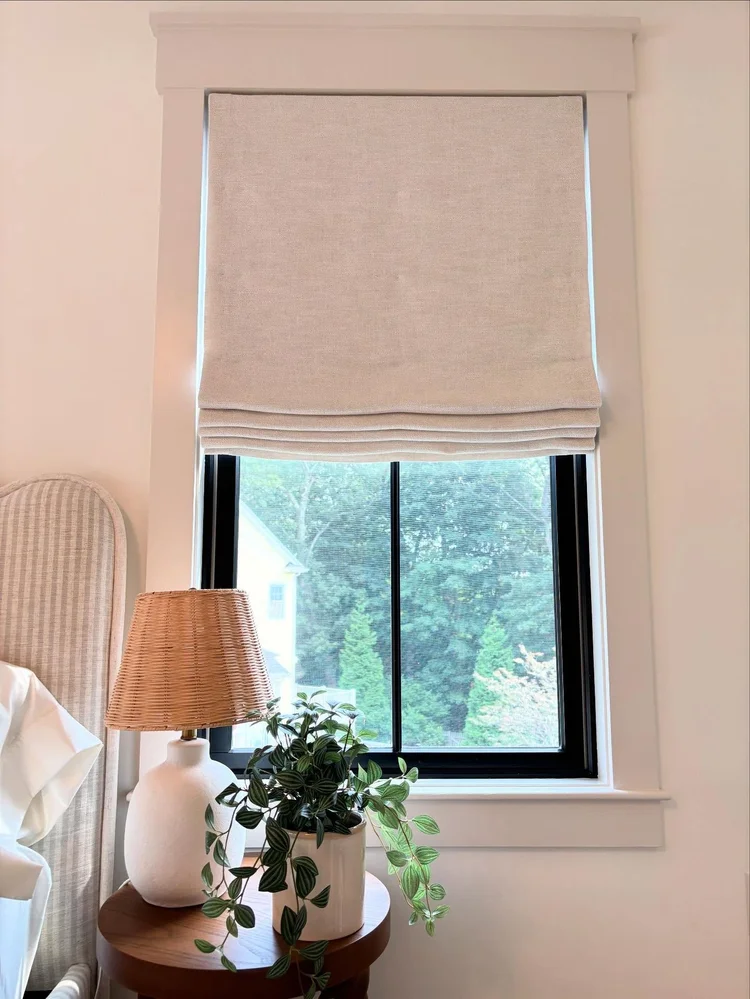 Motorized roller shades on tall windows